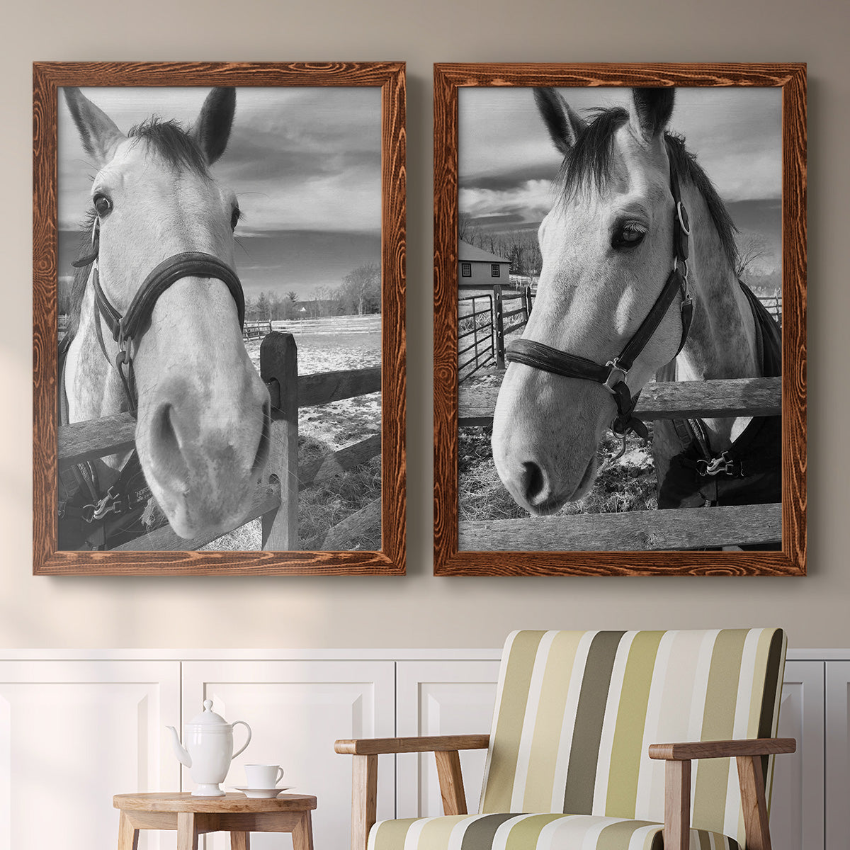 Set of two maple barnwood framed canvas prints depicting two modern equestrian photography featuring black-and-white close-up portraits of horses at fences above a sideboard in a cozy sitting room.