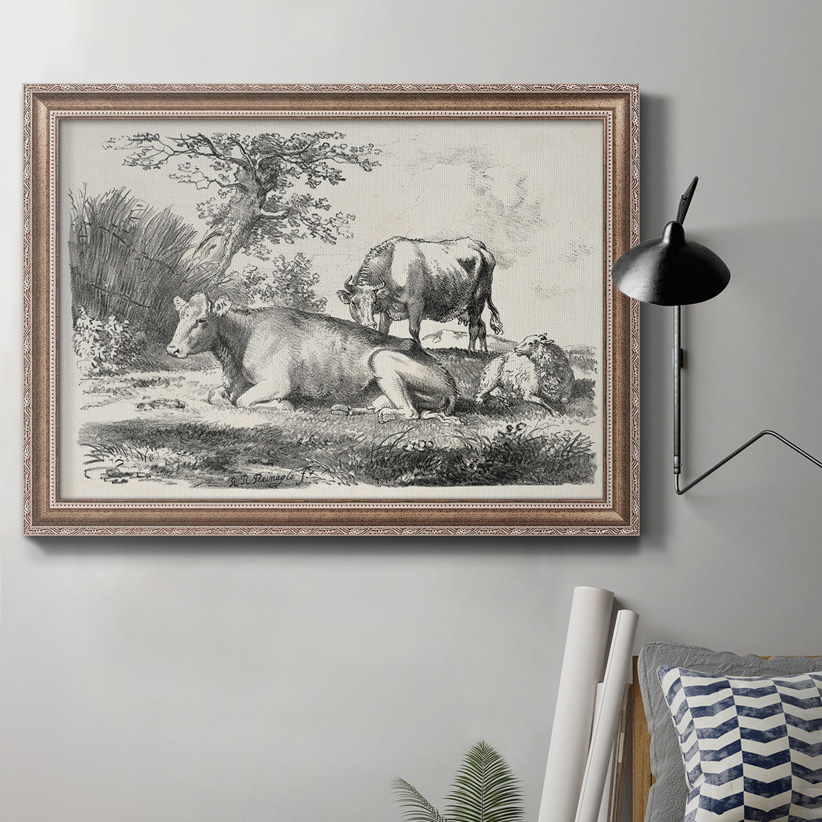 Classical pastoral landscape artwork by Nicolas Berchem in an ornate traditional silver frame displayed in a neutral interior setting.