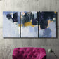 Three-panel canvas wall art featuring icy abstract arctic ledge, displayed in a living room above a suede accent chair.