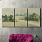 Three-panel canvas wall art featuring pasture landscape in soft watercolor, displayed in a living room above a suede accent chair.
