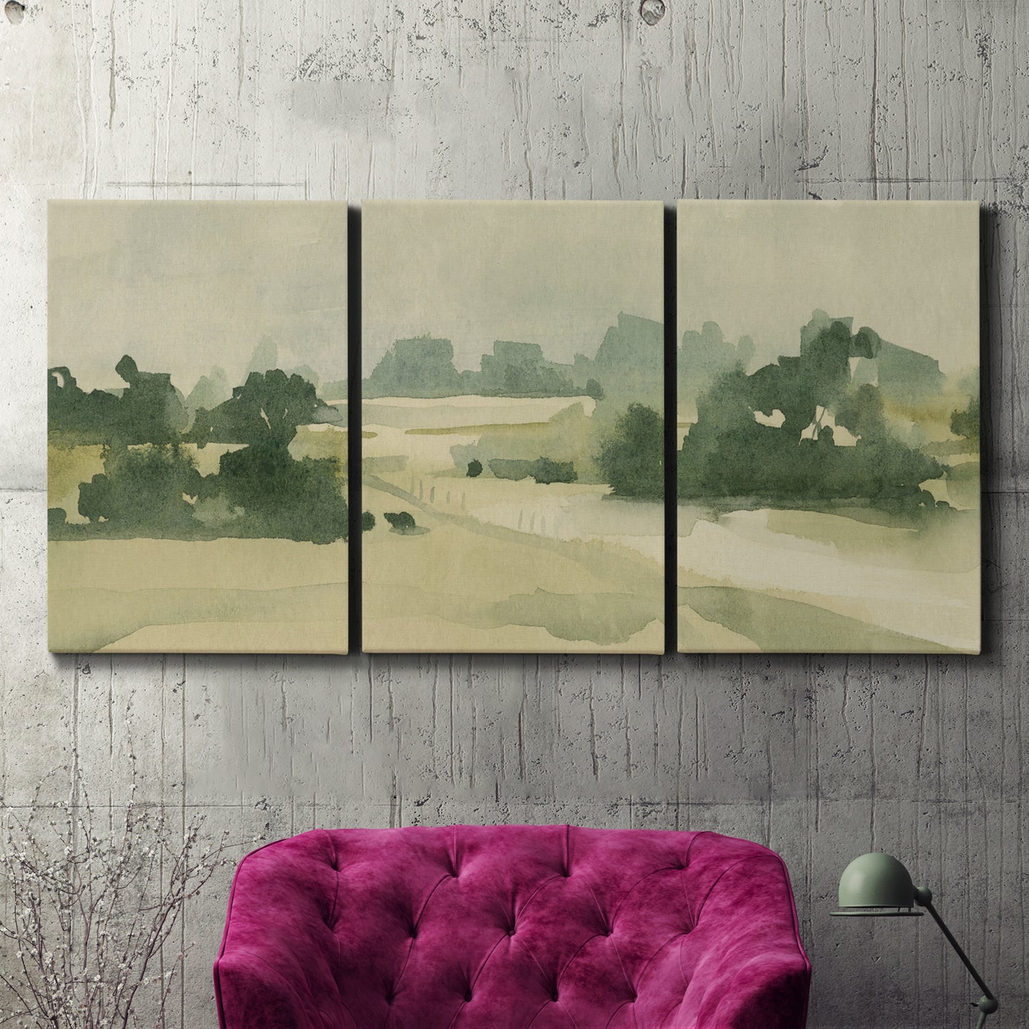 Three-panel canvas wall art featuring pasture landscape in soft watercolor, displayed in a living room above a suede accent chair.