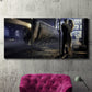 Three-panel canvas wall art featuring couple kissing at train station, displayed in a living room above a suede accent chair.
