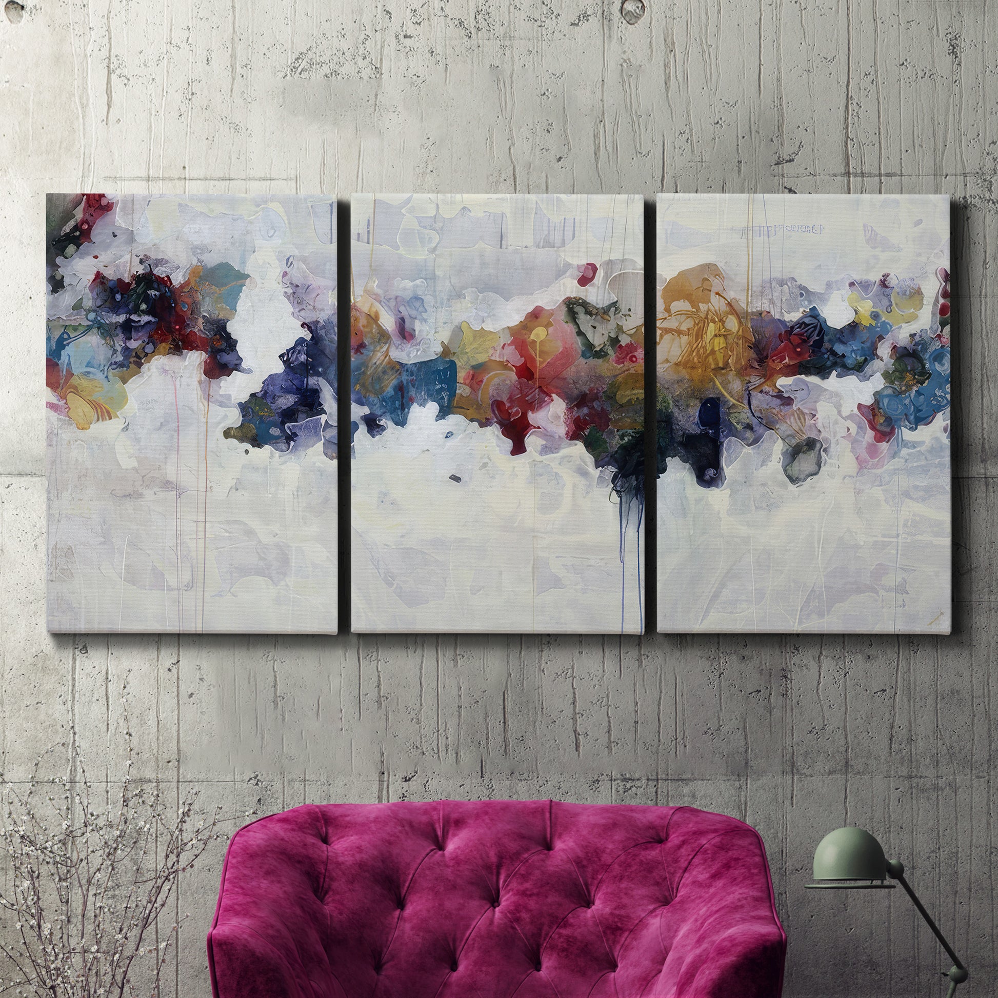 Three-panel canvas wall art featuring abstract water inspired composition, displayed in a living room above a suede accent chair.