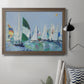 Coastal harbor watercolor painting in an ornate traditional bronze frame displayed in a neutral interior setting.