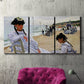 Three-panel canvas wall art featuring figures walking along sandy beach, displayed in a living room above a suede accent chair.
