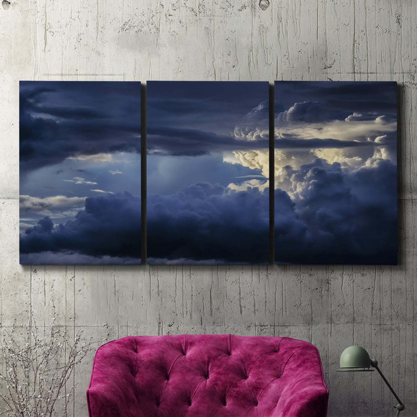Three-panel canvas wall art featuring hot air balloons rising at dawn, displayed in a living room above a suede accent chair.