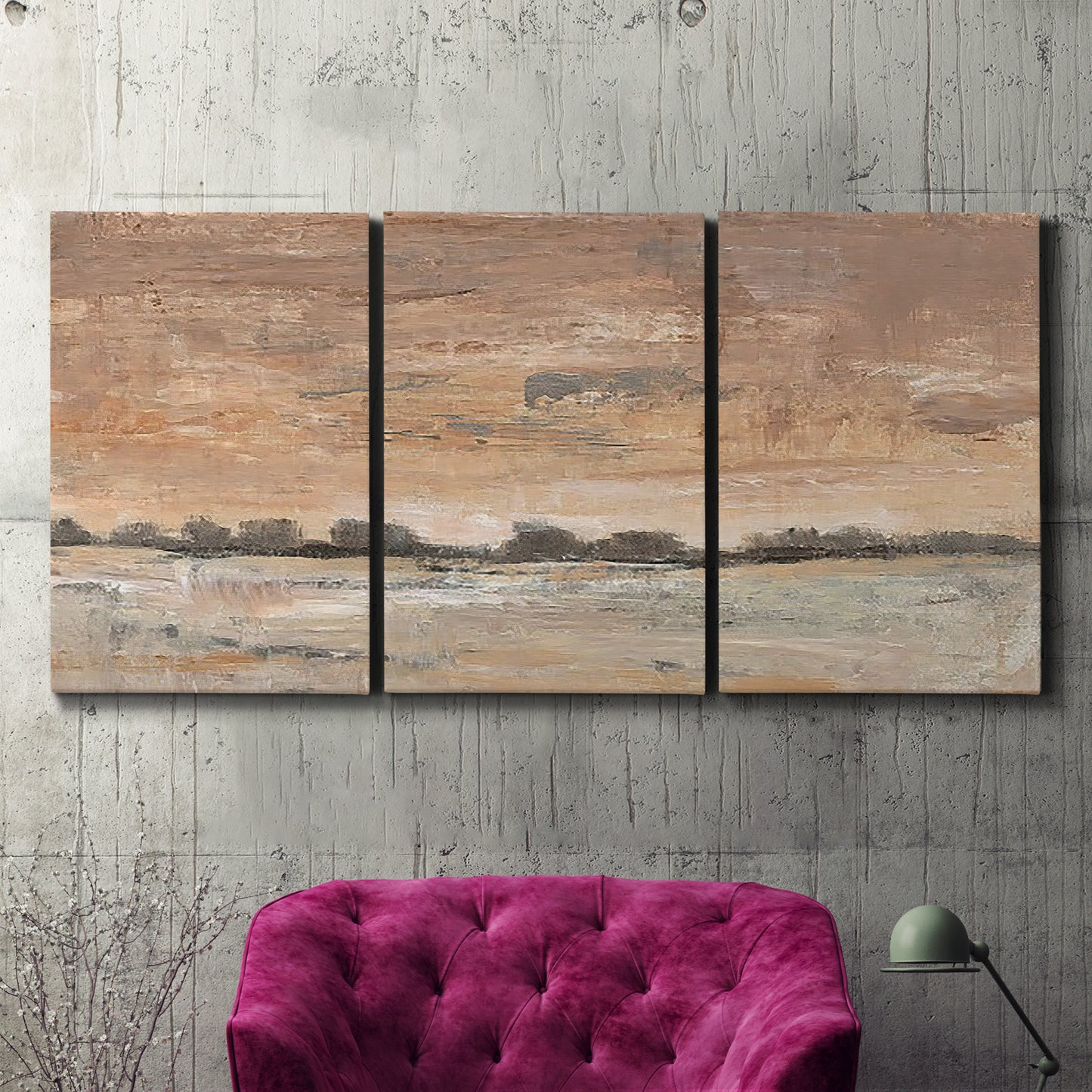 Three-panel canvas wall art featuring soft early evening landscape light, displayed in a living room above a suede accent chair.