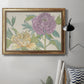 Contemporary peony flower illustration in an ornate vintage gold frame displayed in a neutral interior setting.