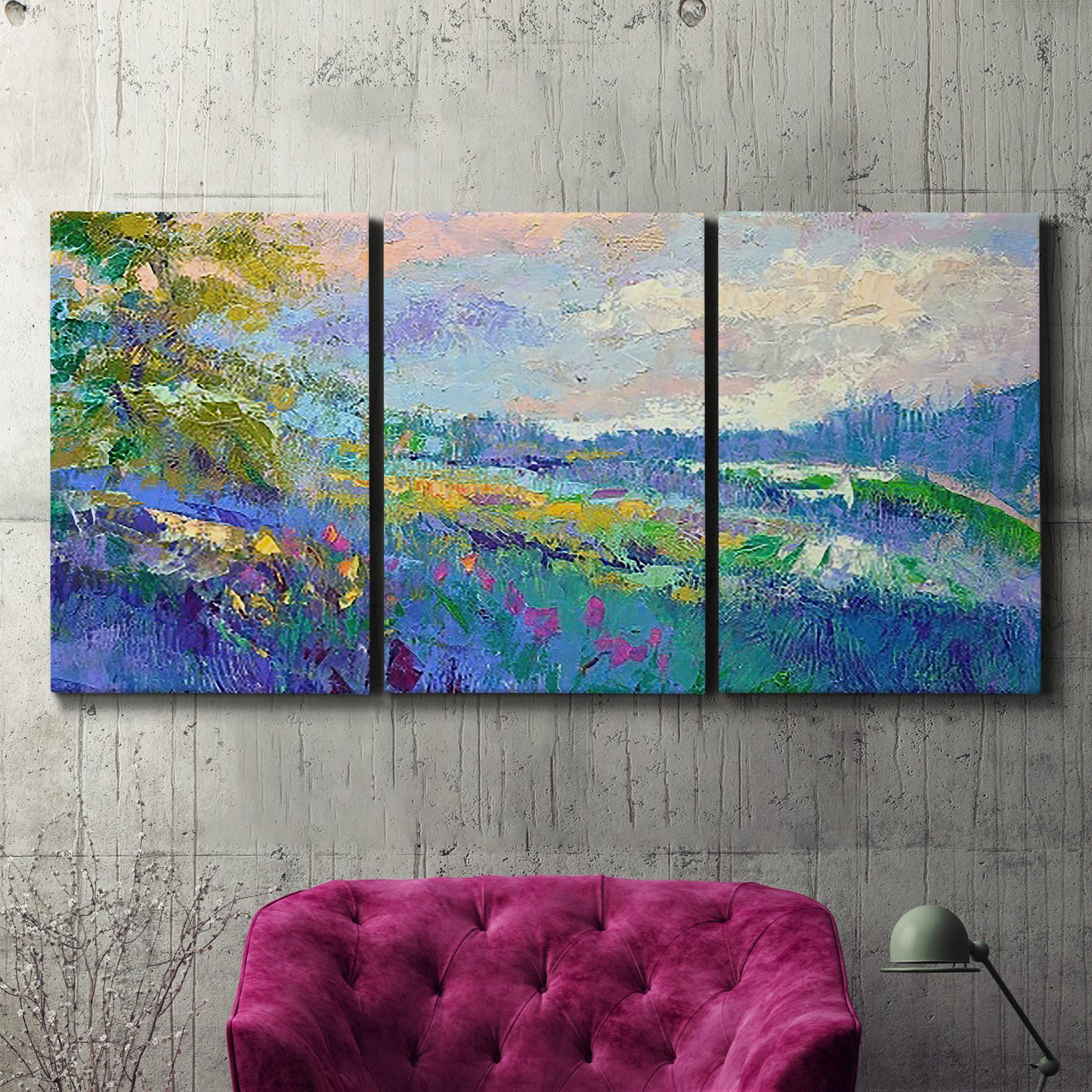 Three-panel canvas wall art featuring cheerful landscape under open sky, displayed in a living room above a suede accent chair.