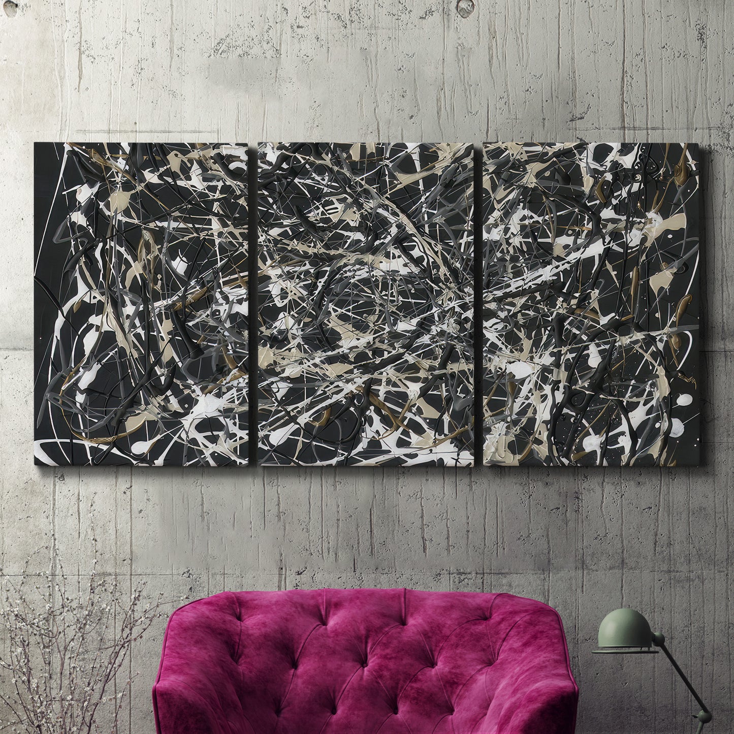 Three-panel canvas wall art featuring energetic expressionist abstract splatter, displayed in a living room above a suede accent chair.