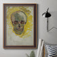 Expressive skull study painting by Vincent van Gogh in an ornate bronzed mahogany wood frame displayed in a neutral interior setting.