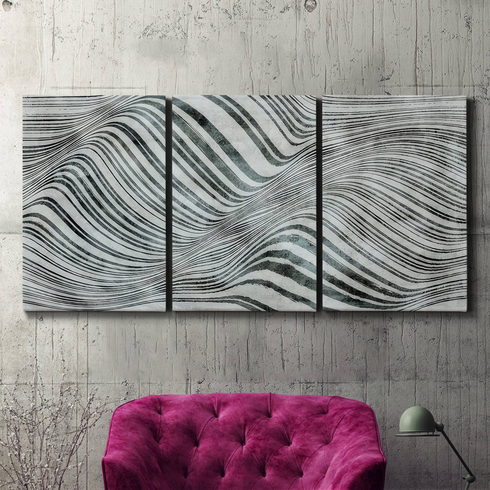 Three-panel canvas wall art featuring coastal shoreline with gentle surf, displayed in a living room above a suede accent chair.