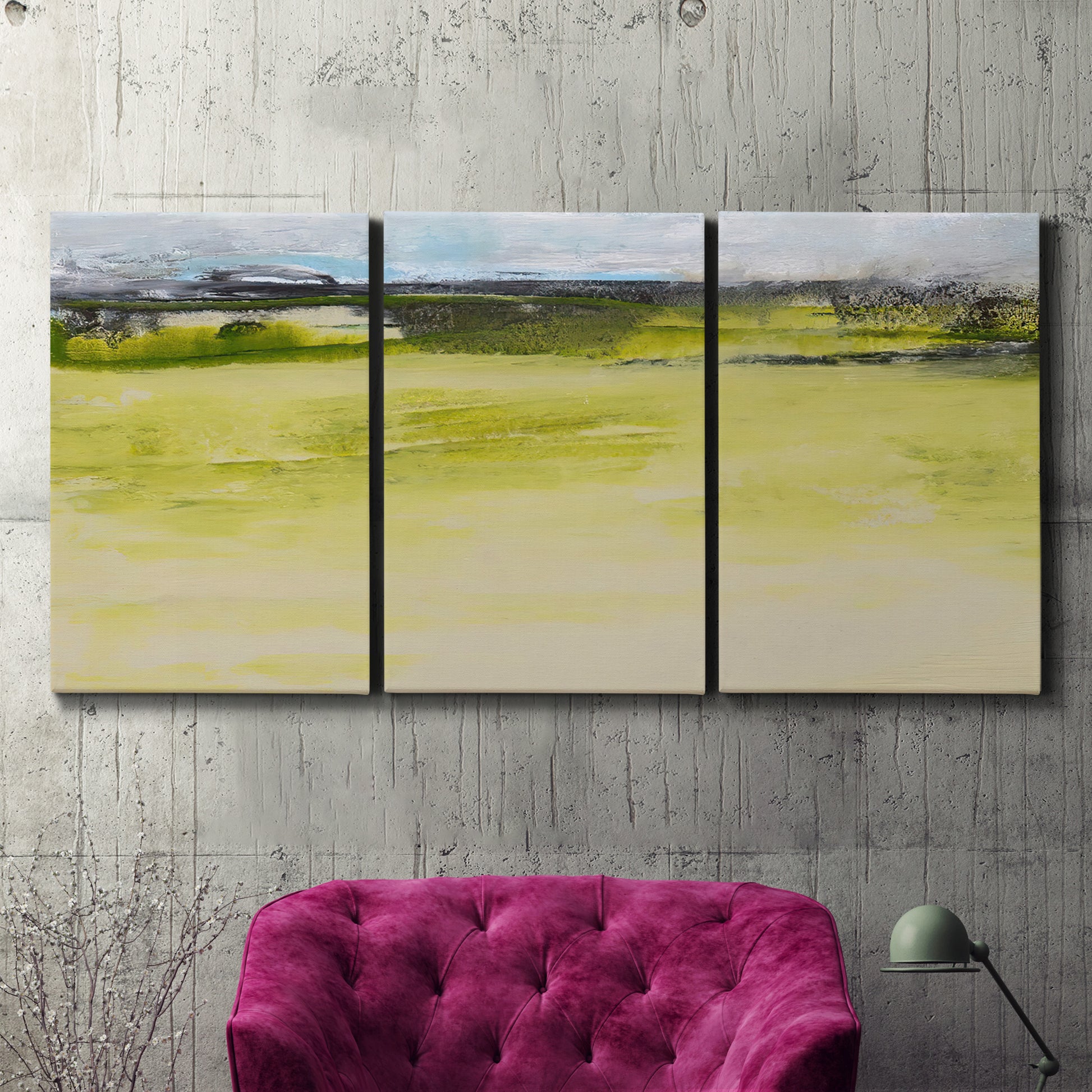 Three-panel canvas wall art featuring abstract terrace landscape view, displayed in a living room above a suede accent chair.