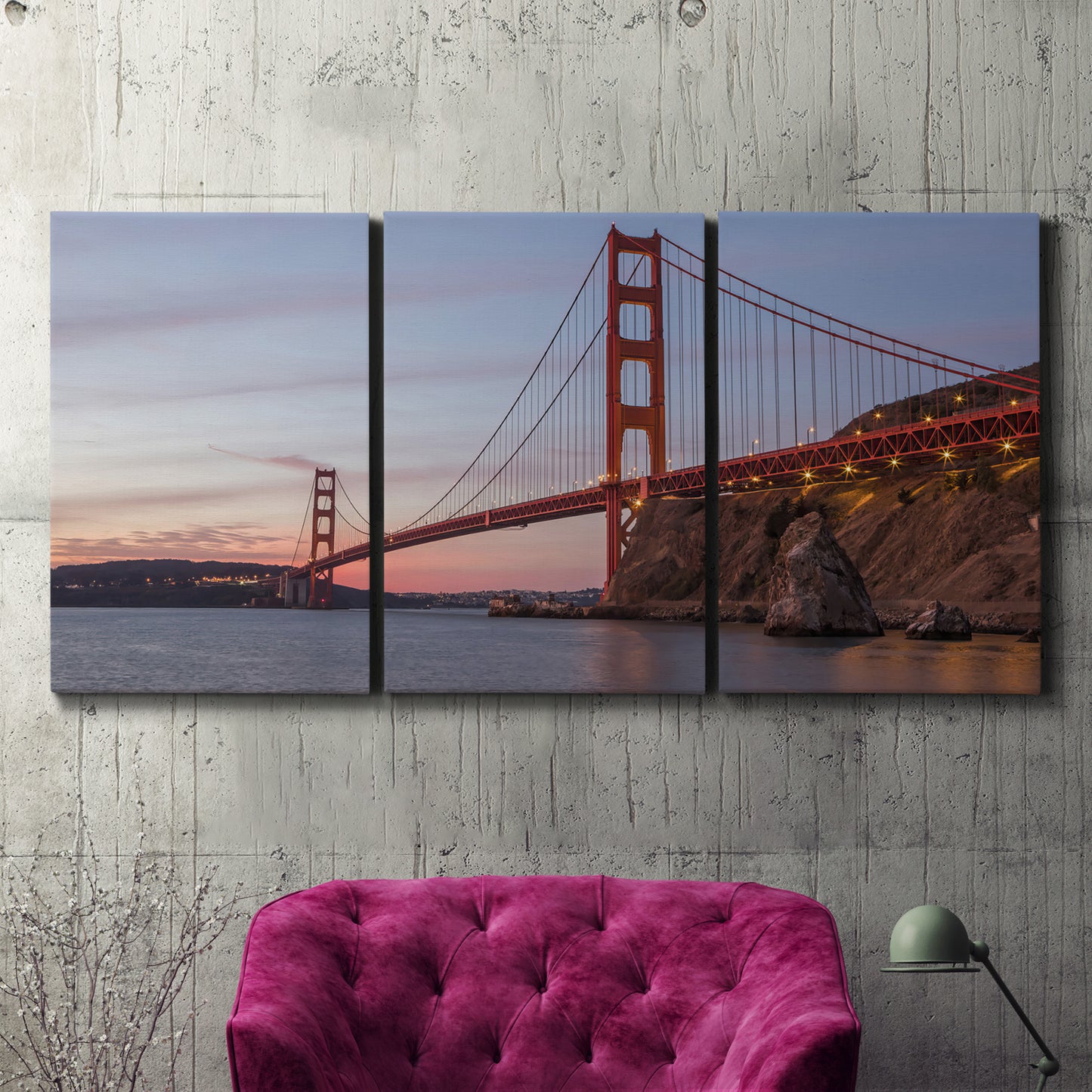 Three-panel canvas wall art featuring golden gate bridge spanning bay, displayed in a living room above a suede accent chair.