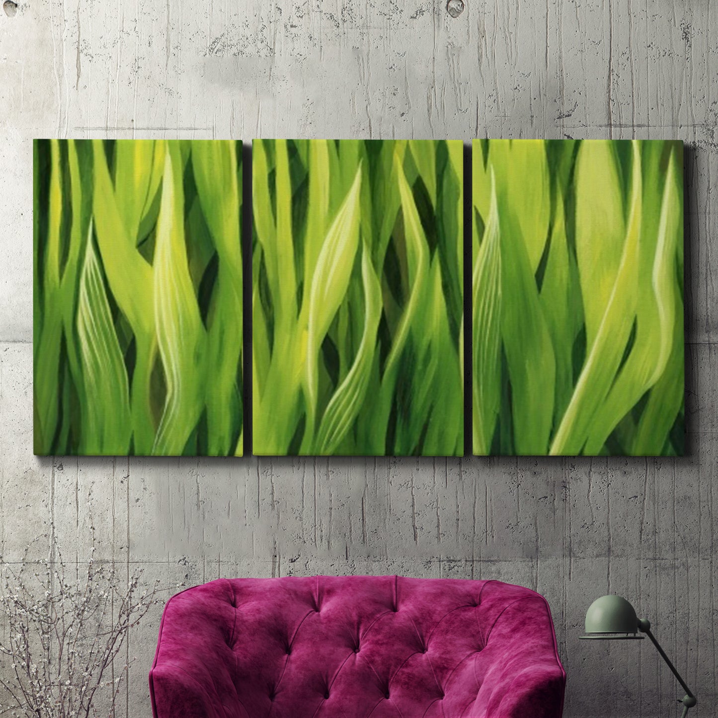 Three-panel canvas wall art featuring close view of tall green grass blades, displayed in a living room above a suede accent chair.