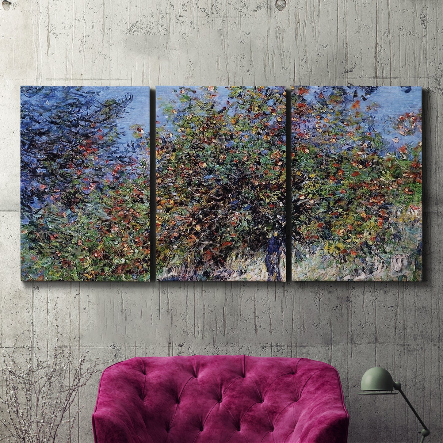 Three-panel canvas wall art featuring orchard of trees in spring bloom, displayed in a living room above a suede accent chair.