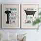 Set of two white barnwood framed canvas prints depicting black tubs, hand-lettered phrases, and small teal accents arranged across two complementary compositions above a sofa in a bright living space.
