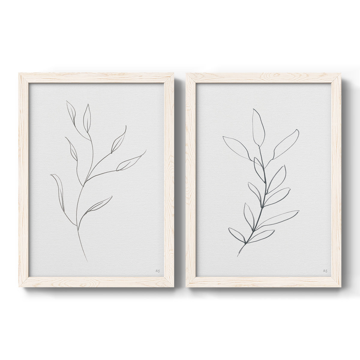 Set of two white barnwood framed canvas prints featuring two minimalist botanical line drawings featuring single continuous-line leafy branches.