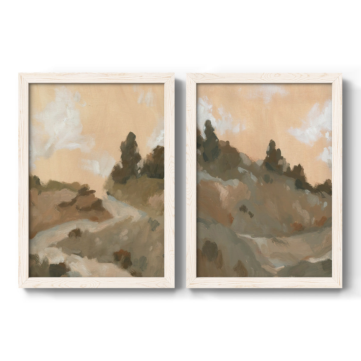 Set of two white barnwood framed canvas prints featuring two minimalist watercolor landscapes featuring misty brown hills and winding mountain paths.