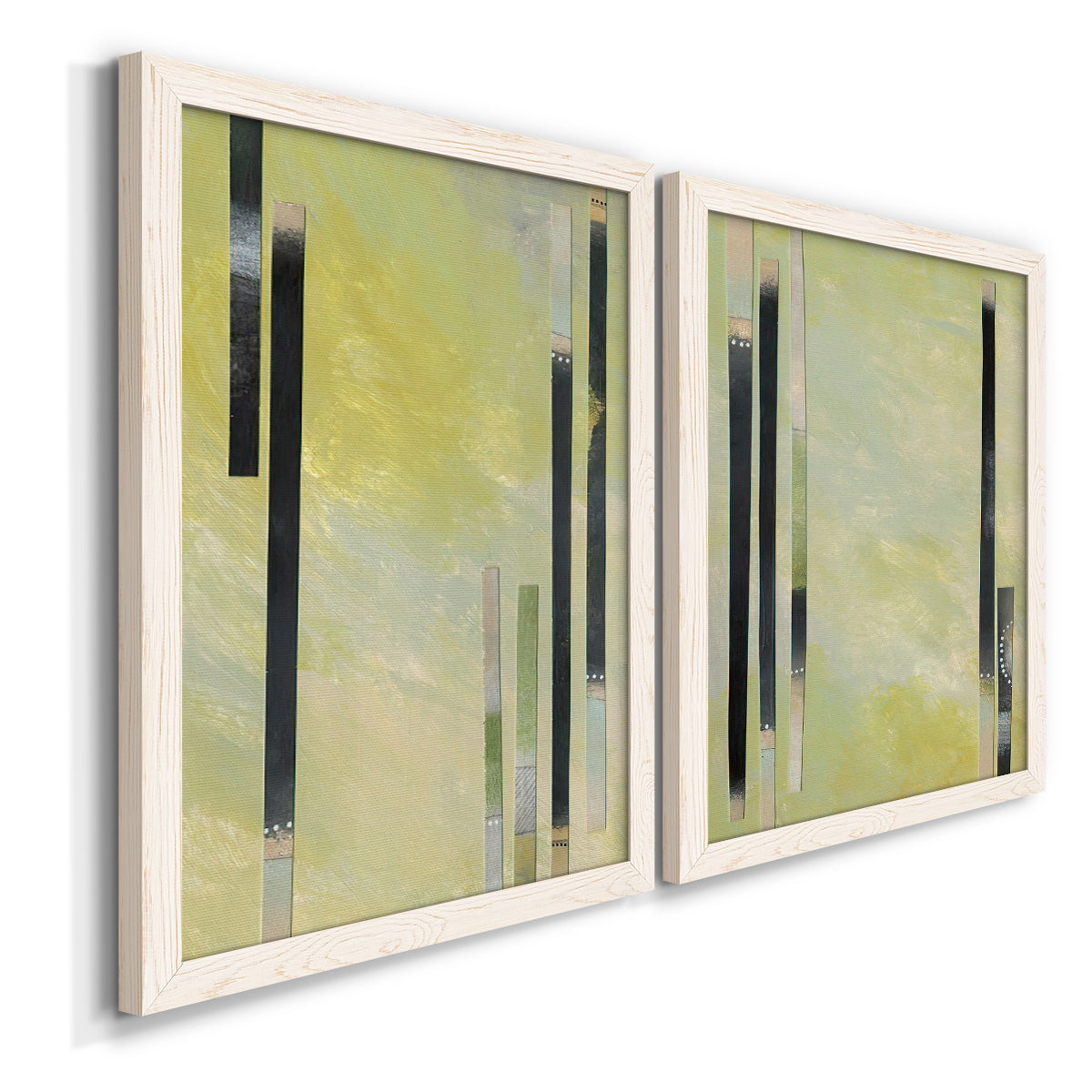 Angled view of a set of two white barnwood framed canvas prints featuring two minimalist architectural abstracts featuring vertical black gray and olive bars.