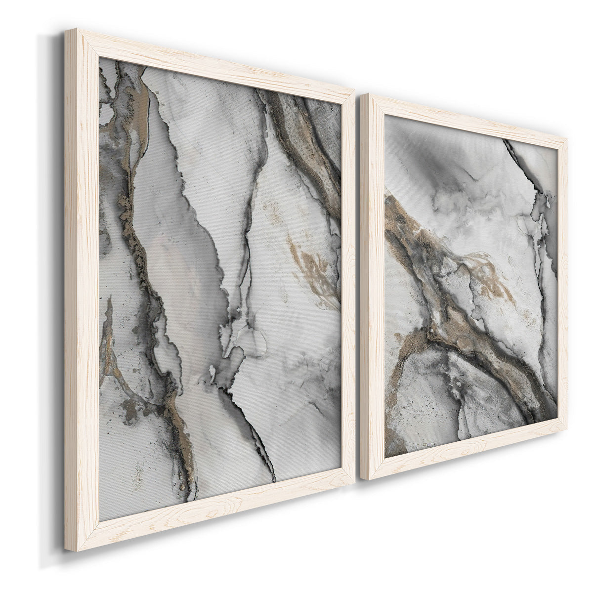 Angled view of a set of two white barnwood framed canvas prints featuring two marbled alcohol ink abstracts with flowing black gray white and metallic gold veining.