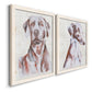 Angled view of a set of two white barnwood framed canvas prints featuring two traditional watercolor pet paintings featuring gentle seated dog portraits.