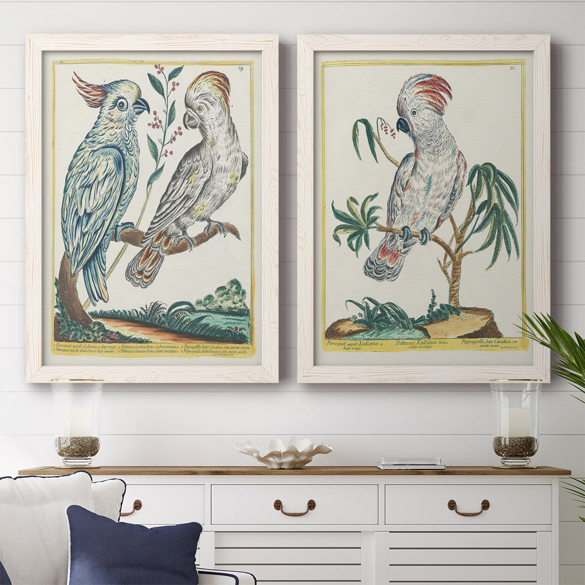Set of two white barnwood framed canvas prints depicting a coordinated art pair of misty blue gray and violet marks hovering across pale grounds rendered as atmospheric abstract paintings above a dining room sideboard.