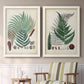 Set of two white barnwood framed canvas prints depicting two natural-history fern plates featuring vintage fern specimens with botanical details above a sideboard in a cozy sitting room.