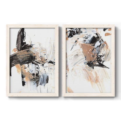 Set of two white barnwood framed canvas prints featuring two bold mixed-media abstracts featuring energetic black white tan and gray painted gestures.
