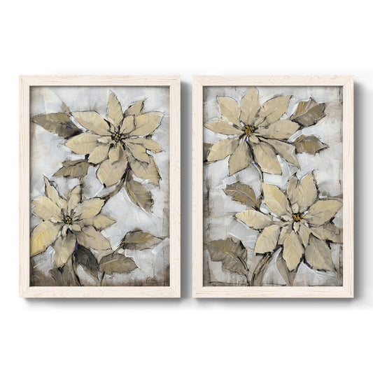 Set of two white barnwood framed canvas prints featuring two textured botanical paintings featuring large pale poinsettia blossoms.