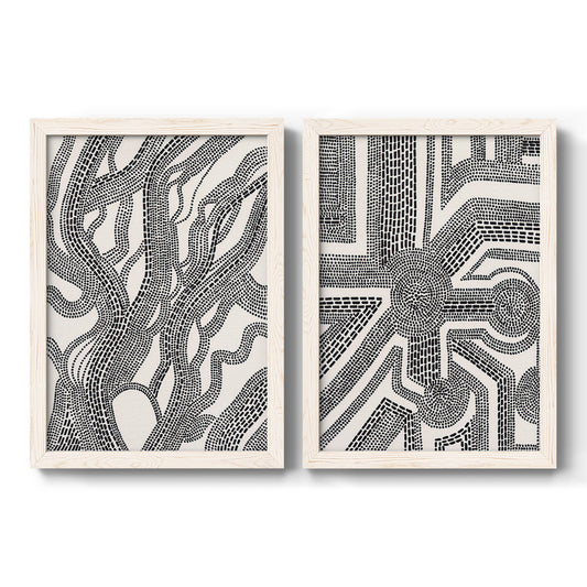 Set of two white barnwood framed canvas prints featuring two graphic pattern abstracts featuring intricate black linear mazes and repeating marks.