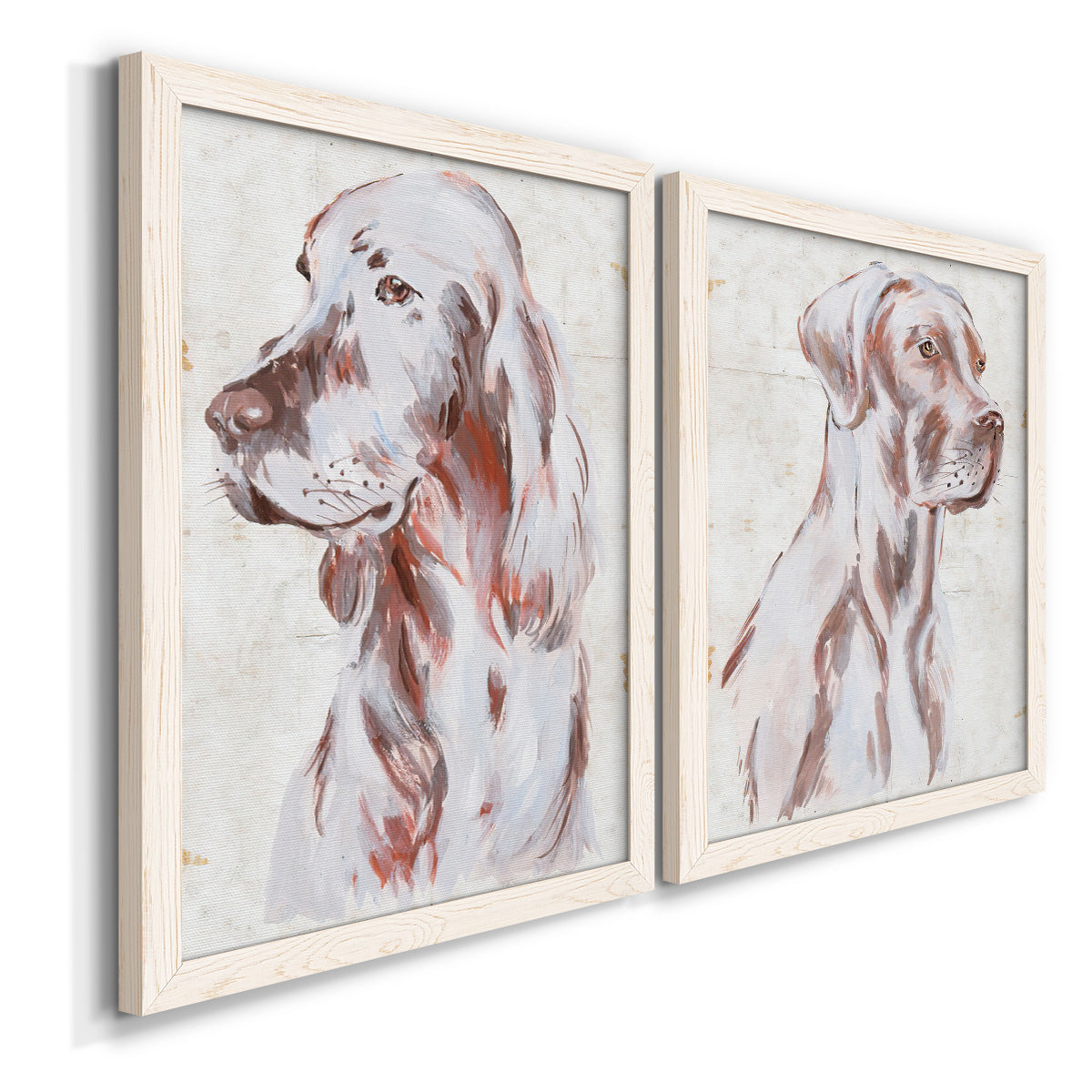 Angled view of a set of two white barnwood framed canvas prints featuring two traditional watercolor pet paintings featuring gentle seated dog portraits.