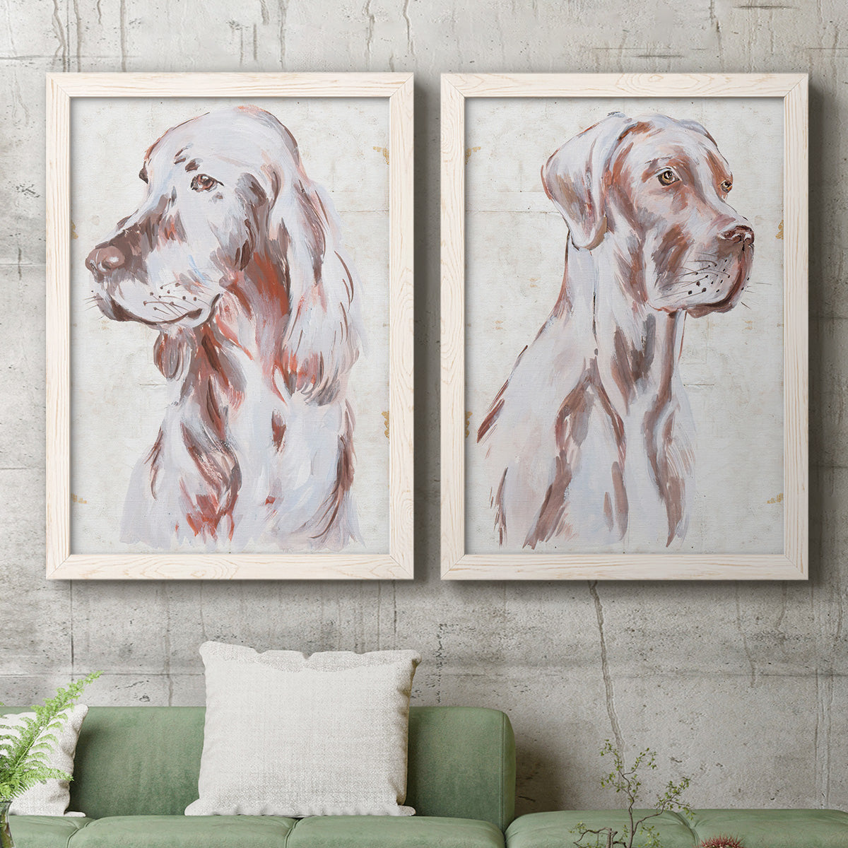 Set of two white barnwood framed canvas prints depicting a coordinated art pair of gentle seated dog portraits rendered as traditional watercolor pet paintings above a sofa in a modern living room.