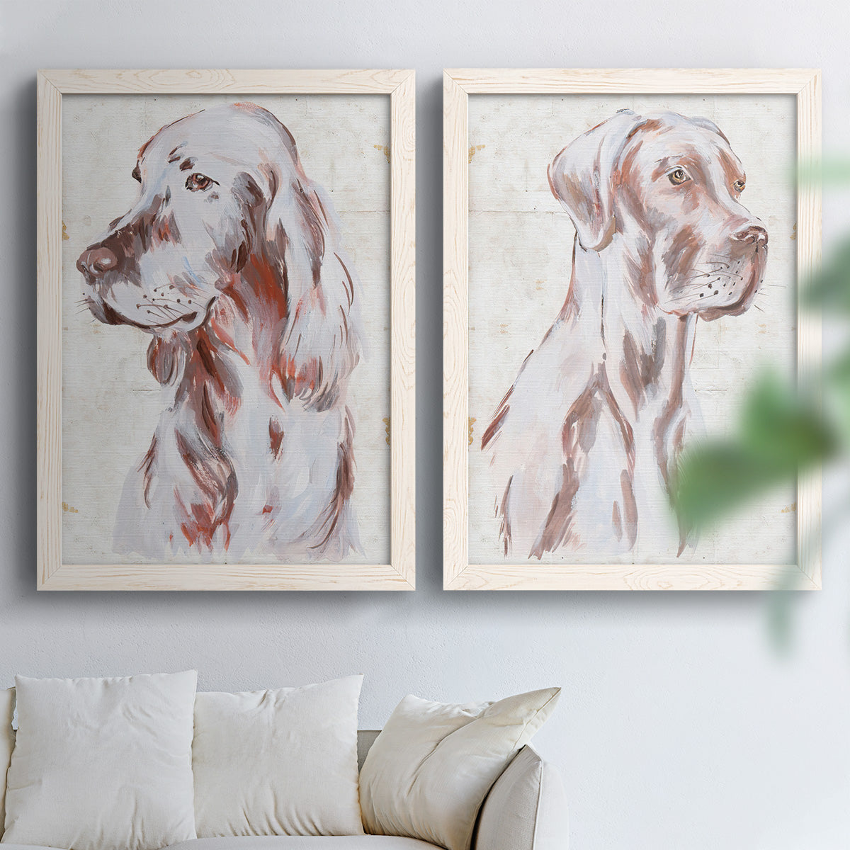 Set of two white barnwood framed canvas prints depicting soft brown and gray fur, expressive faces, and lightly distressed cream grounds arranged across two complementary compositions above a sofa in a bright living space.