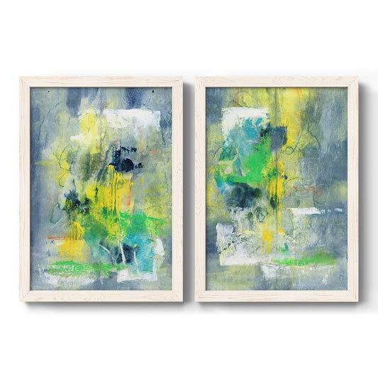 Set of two white barnwood framed canvas prints featuring two airy contemporary abstracts featuring soft blue green yellow and gray painterly blocks.
