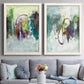 Set of two white barnwood framed canvas prints depicting paired expressive contemporary abstracts with soft-edged color masses, looping lines, and pale blue grounds above a sofa in a contemporary living room.