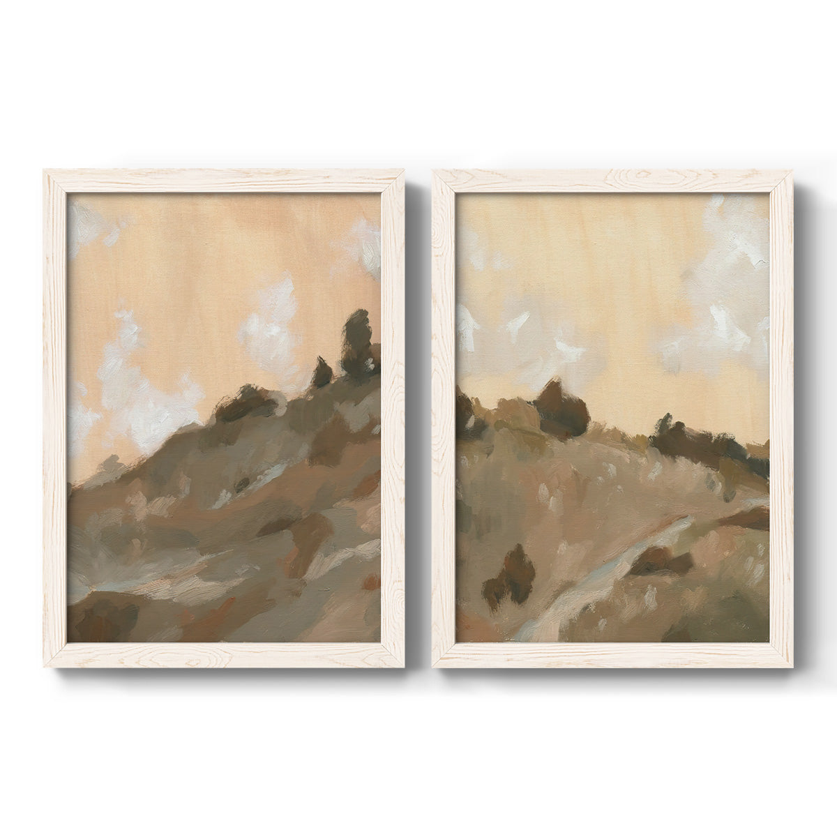 Set of two white barnwood framed canvas prints featuring two minimalist watercolor landscapes featuring misty brown hills and winding mountain paths.