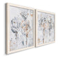 Angled view of a set of two white barnwood framed canvas prints featuring two expressive floral abstracts featuring loosely suggested flowers and stems in pale gray and peach.