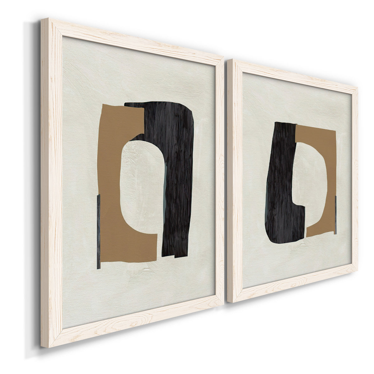 Angled view of a set of two white barnwood framed canvas prints featuring two minimalist geometric collage abstracts featuring black brown and cream cutout-like forms.