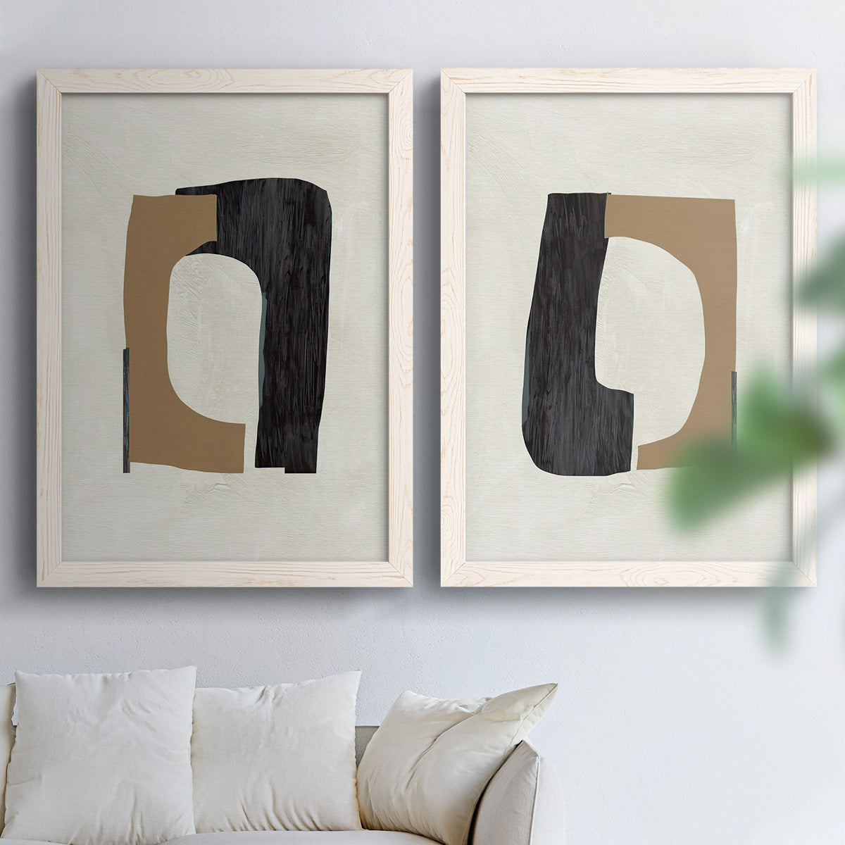 Set of two white barnwood framed canvas prints depicting flat rounded rectangles, irregular openings, and warm paper texture arranged across two complementary compositions above a sofa in a bright living space.
