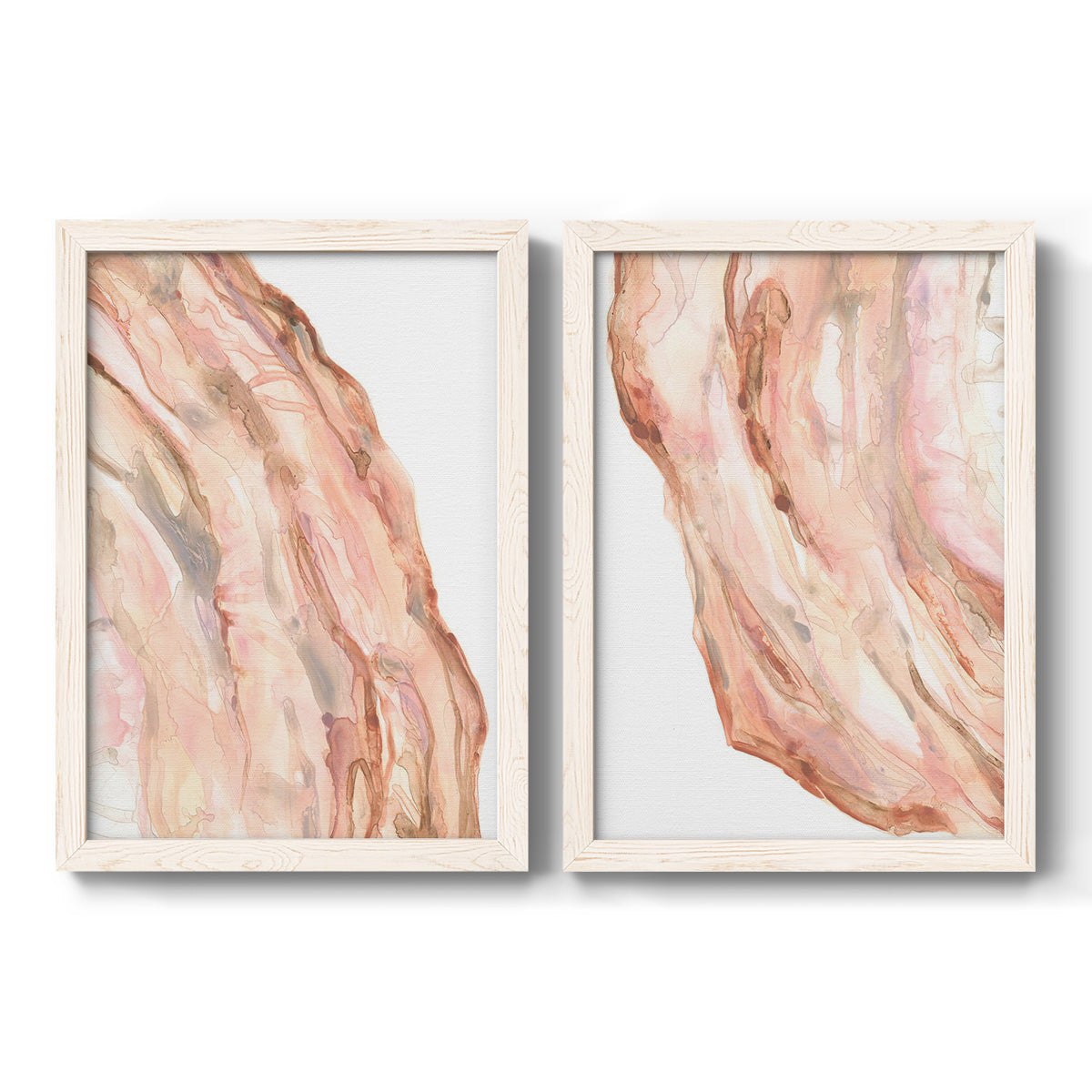 Set of two white barnwood framed canvas prints featuring two soft marble-inspired abstracts featuring flowing blush peach and cream mineral bands.