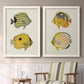 Set of two white barnwood framed canvas prints depicting two natural-history fish illustrations featuring groups of vintage tropical fish above a sideboard in a cozy sitting room.