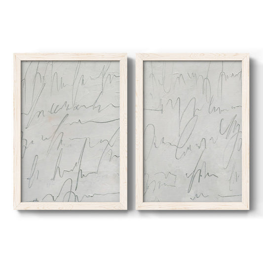 Set of two white barnwood framed canvas prints featuring two minimalist script abstracts featuring faint looping handwriting across pale gray grounds.