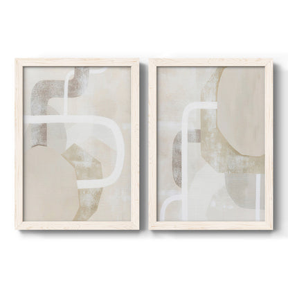 Set of two white barnwood framed canvas prints featuring two neutral geometric abstracts with overlapping rounded forms white lines and soft beige gray textures.