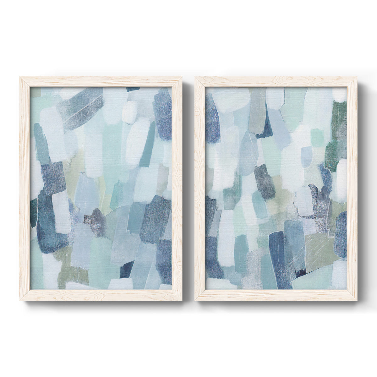 Set of two white barnwood framed canvas prints featuring two cool-toned geometric abstracts featuring fragmented pale blue green gray and white brush blocks.