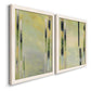 Angled view of a set of two white barnwood framed canvas prints featuring two minimalist architectural abstracts featuring vertical black gray and olive bars.