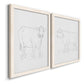 Angled view of a set of two white barnwood framed canvas prints featuring two minimalist livestock sketches featuring simple contour drawings of standing cows.