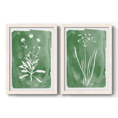 Set of two white barnwood framed canvas prints featuring two rustic minimalist botanical studies featuring delicate wildflower and leafy stems.