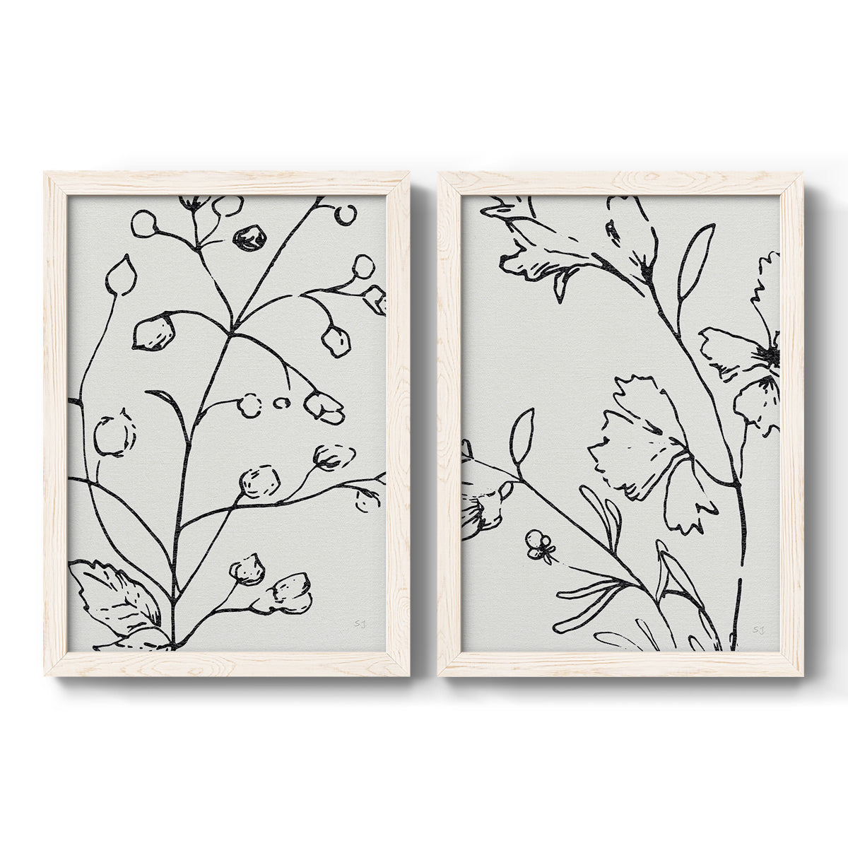 Set of two white barnwood framed canvas prints featuring two minimalist botanical line art featuring black contour drawings of leaves and flowers.