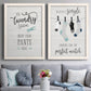 Set of two white barnwood framed canvas prints depicting paired rustic typographic wall art with hand-lettered phrases, socks hangers and laundry symbols on linen texture above a sofa in a contemporary living room.